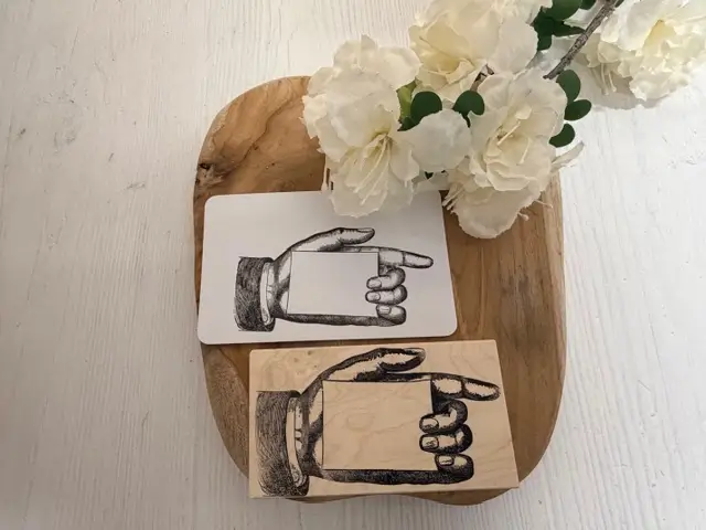 Large hand holding blank card