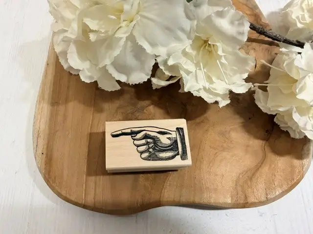 Victorian hand pointing left