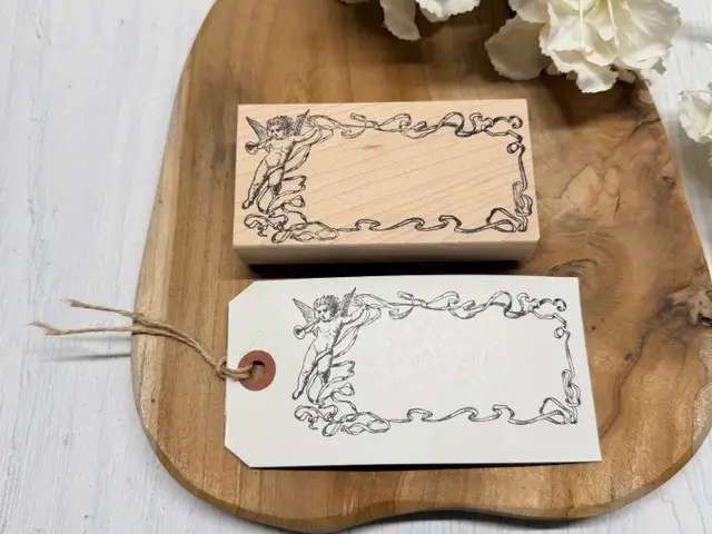 Ribbon and cherub frame